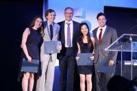 Graduates pose with their awards with Chairman of the department